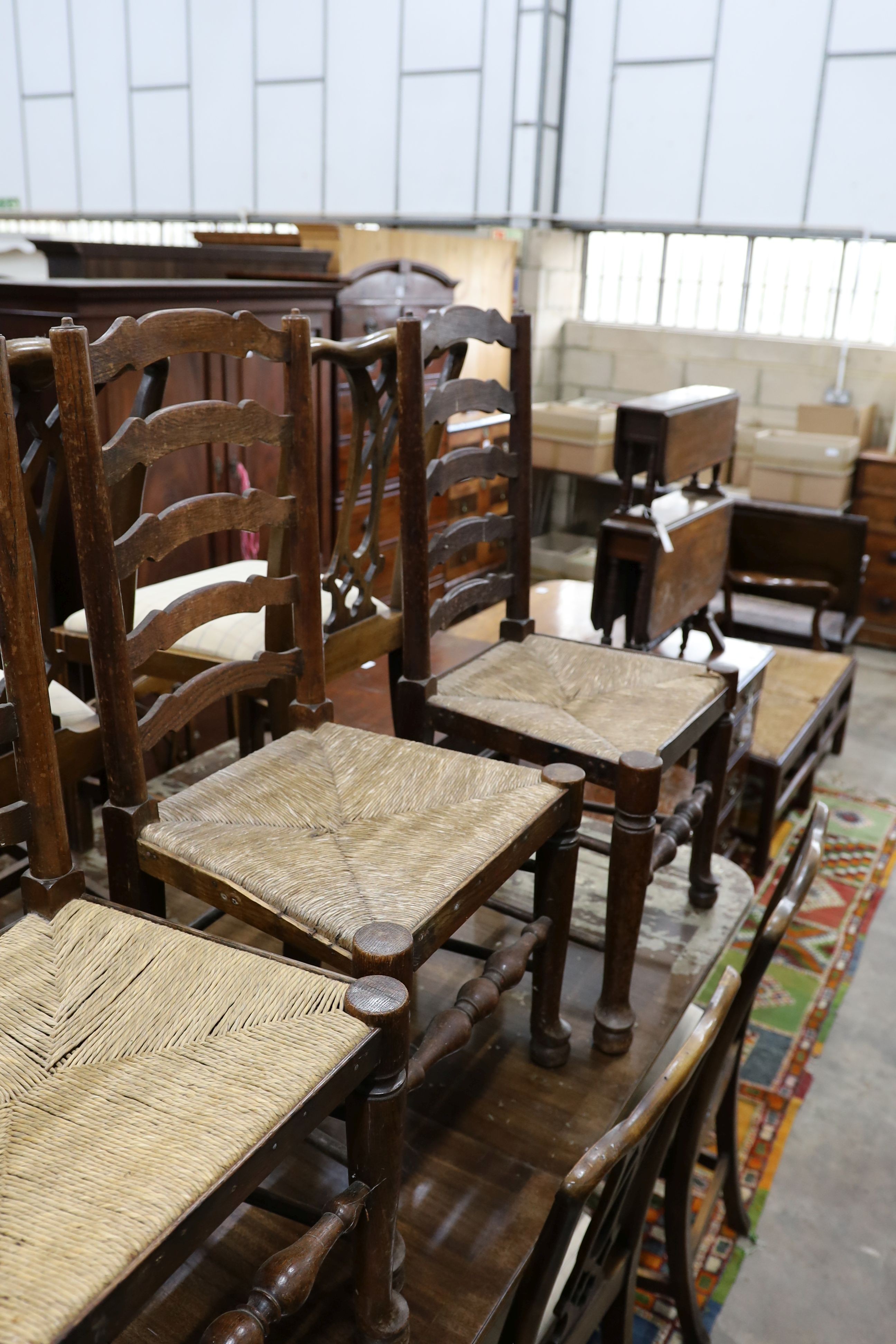 A set of six oak rush seat ladder back chairs